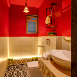 Ina - Villa in Siolim Goa - Washroom 3 with washbasin, shaving mirror, towels, and libght