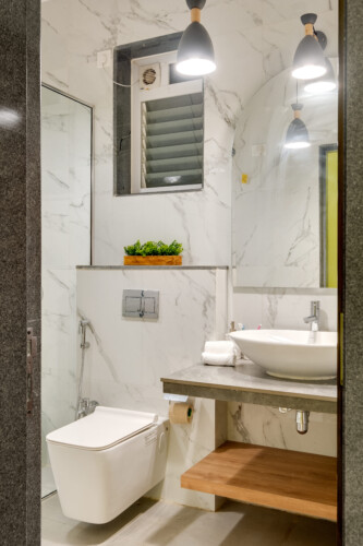 Ina - Villa in Siolim Goa - Washroom 2 with washbasin, shaving mirror, towels, and libght